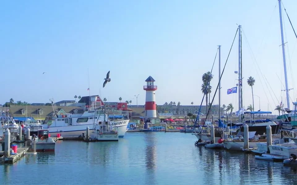 Boats and the lighthouse at Oceanside Harbor Village
